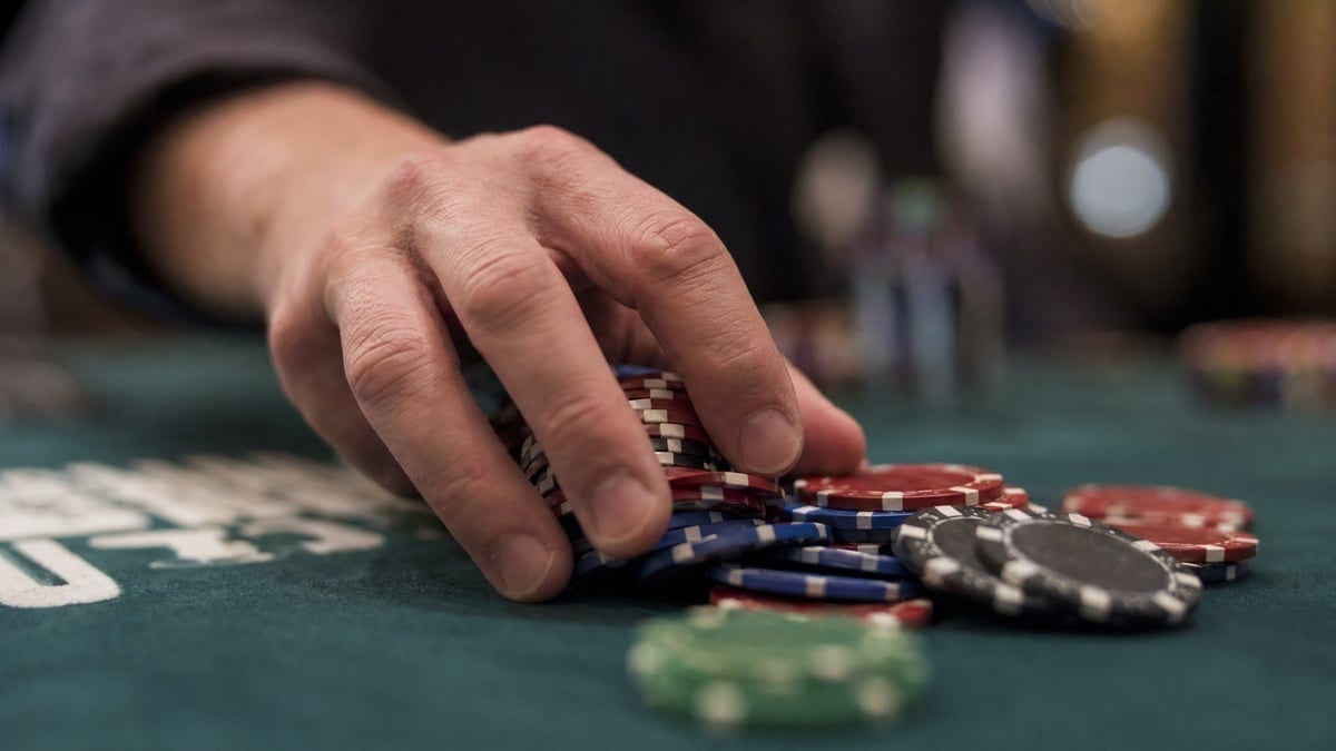 Cash game chips being pushed into the pot